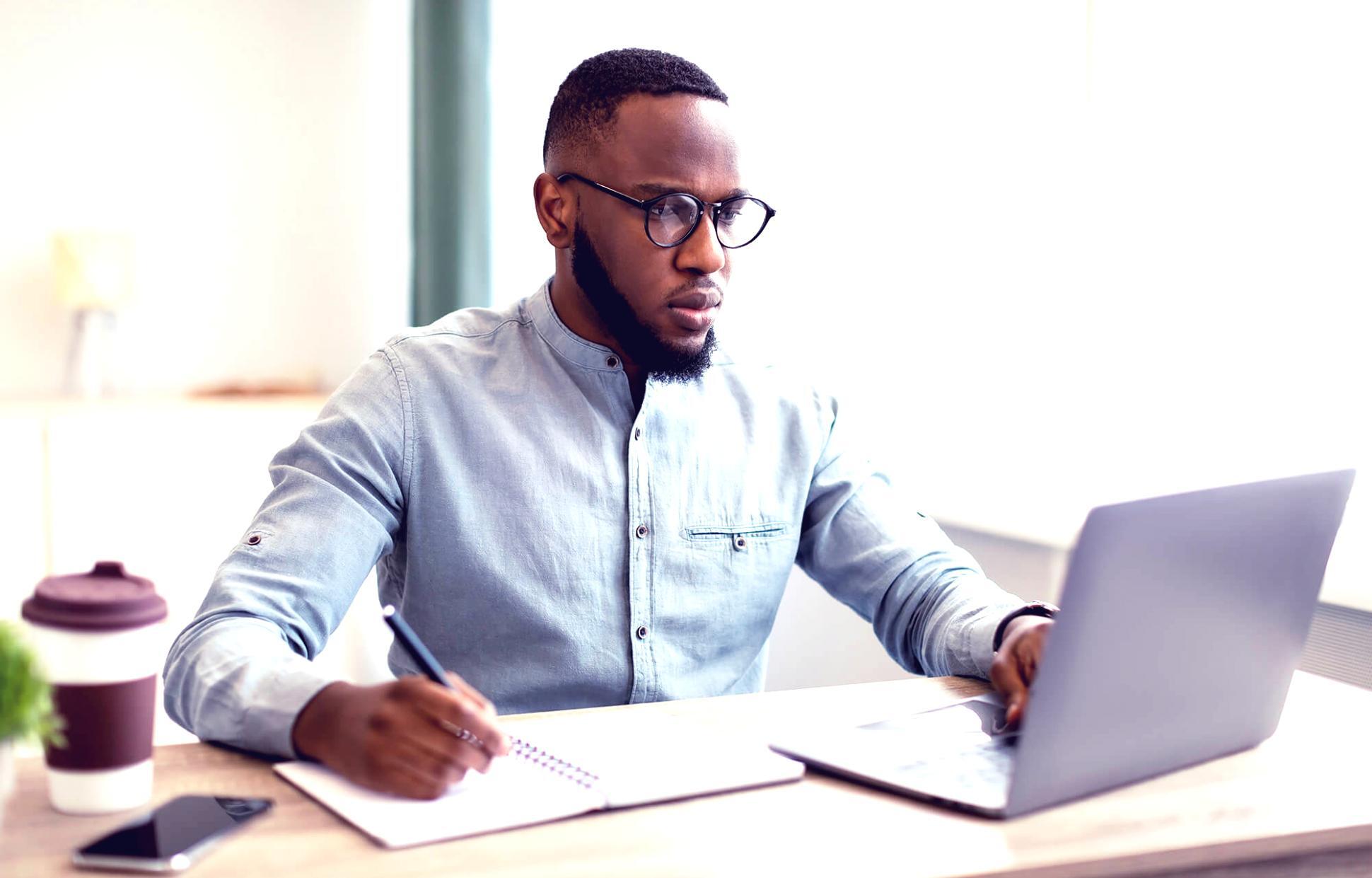Student analyzing financial documents with focused attention